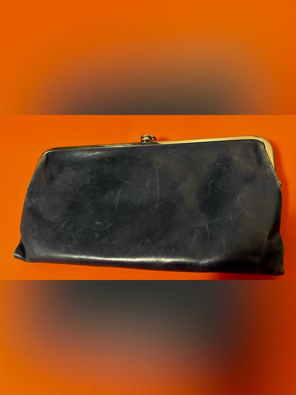 HOBO Lauren clutch wallet in Navy Blue polished leather.